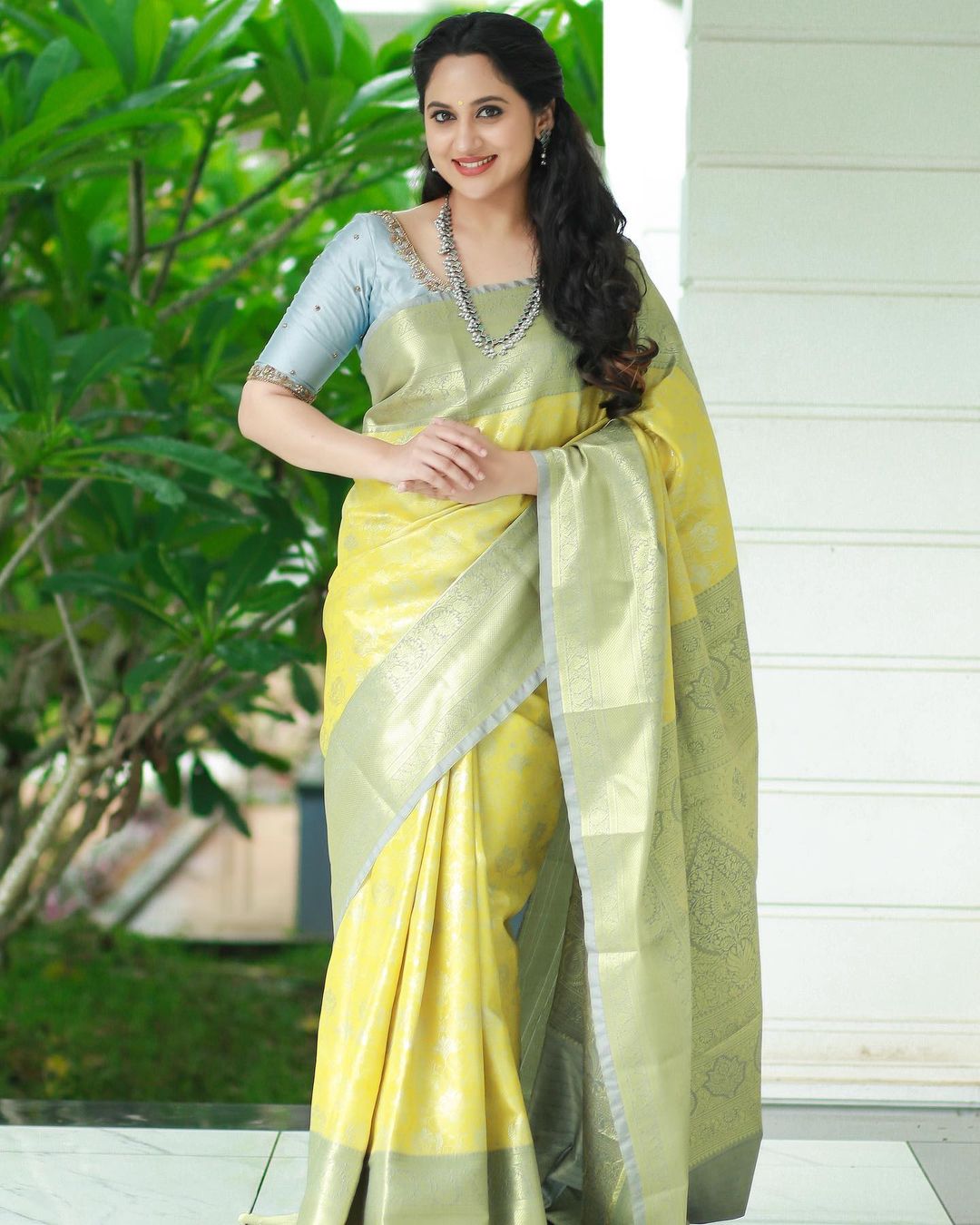 Actress Miya George Beautiful jewelry in Lemon Yellow Saree